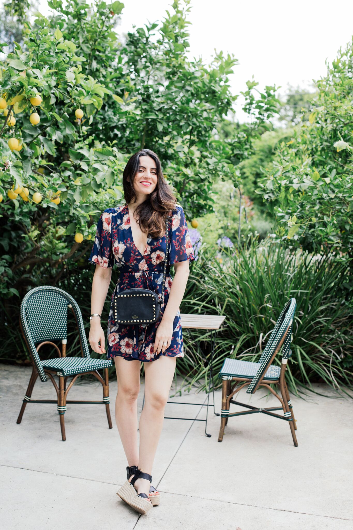 Blogger Style notes by belen wears reformation dress with valentino bag  and vince shoes 